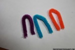 Cut three small pieces of pipe cleaner and fold into and arc shape.