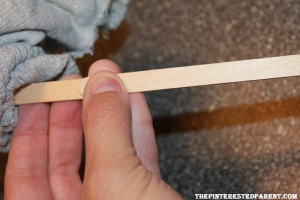 With a glue gun, glue a second stick to the first to lengthen your stick.