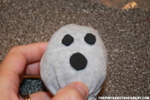 Cut out two tiny foam circles for eyes & one larger circle for the mouth. Add googly eyes to the middle of the eyes.