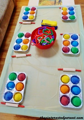 Our activity table had a rainbow collection of homemade Play-Doh for each party goer. Table included rolling pins, a bowl of cookie cutters & molds & Play-Doh presses.