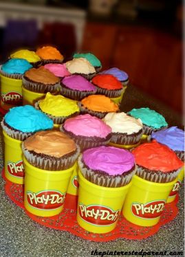 Multi-colored cupcakes fit perfectly inside of empty & clean Play-Doh containers. 